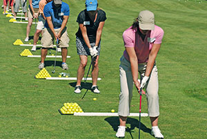 students doing a swing drill in a golf lesson at Blue Rock Golf Course